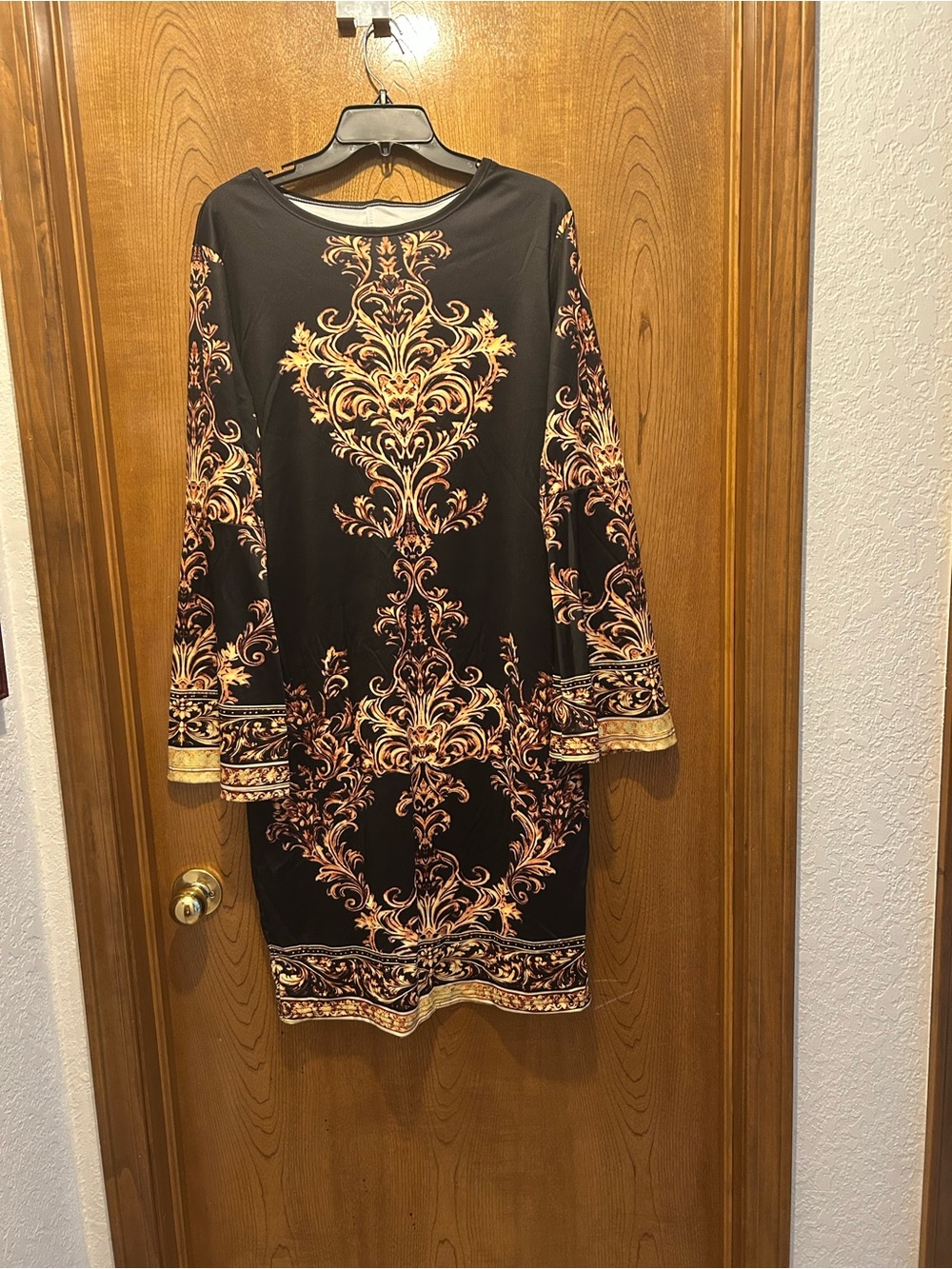 Elegant Black Dress with Gold Baroque Print